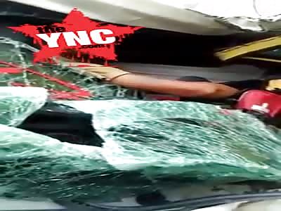 in Indonesia man looks happy being crushed in side his truck