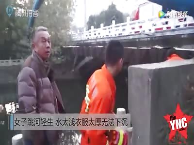 woman tried to kill her self but the water was too shallow and  thick clothes could not make her sink