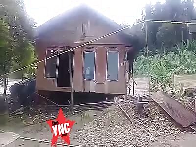 Flood Drags Away a House  in Malutu