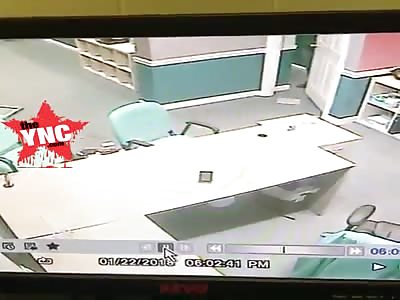 in North Carolina Deer bursts into business, clears shocked worker's desk