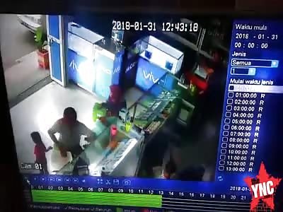 student was ejected from his bike and sent into the mobile phone shop