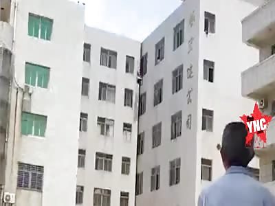 woman jumps of the  7th floor On to the air mattress  in Jinjiang