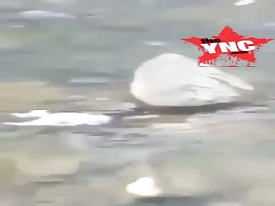  mother throwing her newborn to the river 