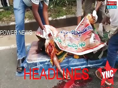 man cries on the road next to his dead wife 