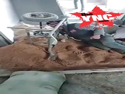 mans head  stuck in a wheelbarrow in guangdong 