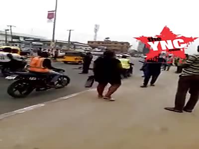 Nigerian man rushes out from a bank in lagos & strips himself naked 