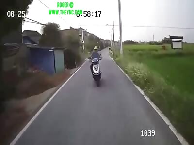 Mr.Tan on his electric bicycle crashed  into the village bus in Xiwan 