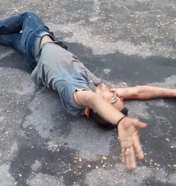 Motorcyclist in Shock On The Sidewalk After Accident .