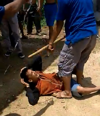 Thief is caught , Beaten with Sticks and Stones