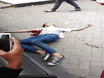 Asian Man Agonizing after gets stabbed in the chest 