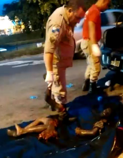 Police Officers Remove Dismembered and Burned Body from a Car Trunk