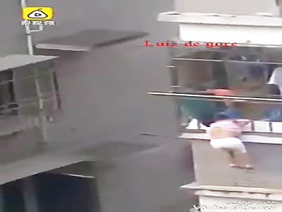 little girl stuck with his head on the railing several feet high