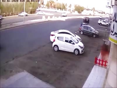 Out of control car sent flying after hitting concrete barrier.