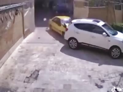 Driver kills pedestrian while crashing through a gate.