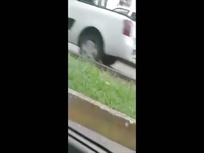 Girl repeatedly smashing her head against a wall.