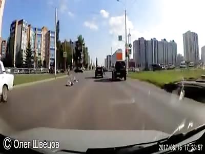 Woman hit and sent flying at red lights.