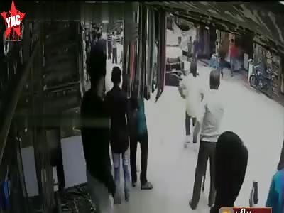 Motorcyclist gets dragged along  road under a van