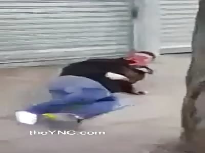 Thief with bloodied face beaten with sticks