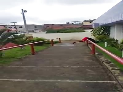 Shot thug bent over a rail