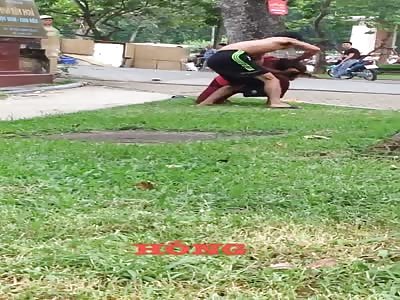 Man beats his wife in the street