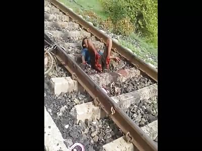Man in agony with feet torn apart by a train