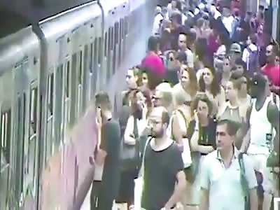 Train drags woman along platform