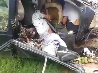 Three people were crushed when a truck hit their car