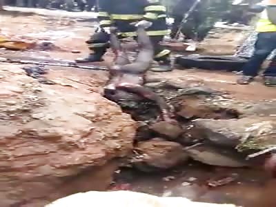 Naked thug dragged out of a trench after being burned by mob