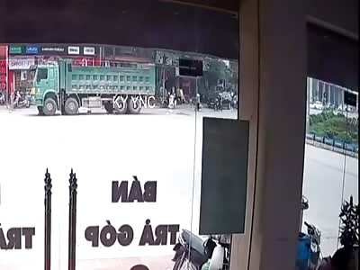 Biker Meets the Wheels of a Ten Ton Truck