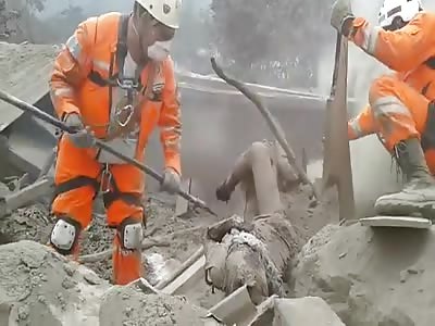 Digging out a Burnt Corpse After Volcano Eruption in Guatemala