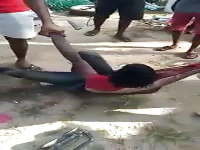 Thief Punished With Sticks