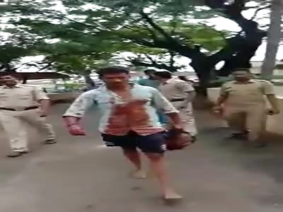 Man Carrying Decapitated Head of his Cheating Wifes Lover (Angle 2)