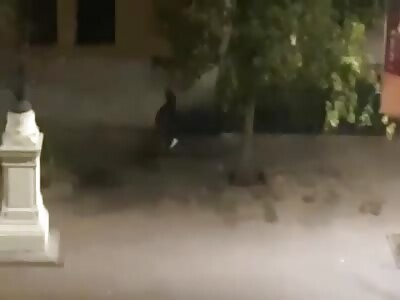 Dominican immigrant on a bicycle stealing in Santiago, Chile