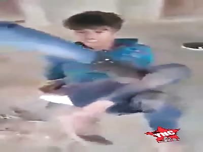 Young boy punished with sticks