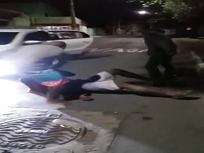 The man is beaten with fists, kicks and sticks