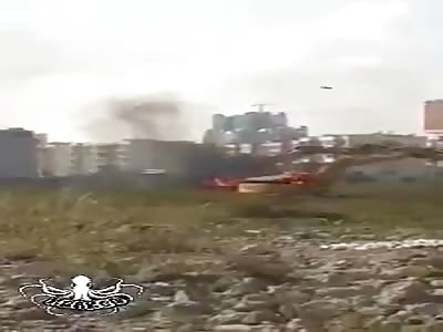 protesters burn backhoe, with molotov cocktails