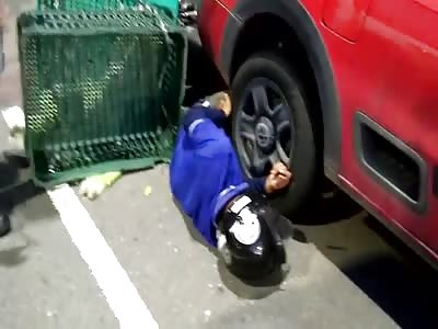 motorcyclist crushed by car