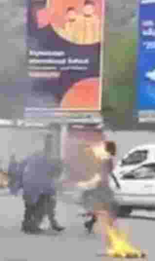 Poor man catches fire