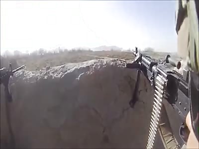 Shooting a powerful machine gun in the Middle East against Syrian rebels