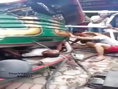 accident! the man ends up under a truck, incredibly not killed