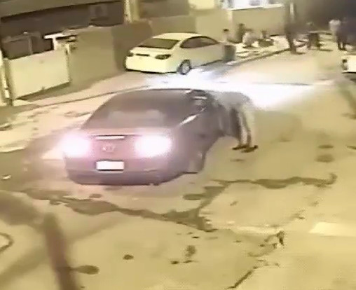 Man gets a crazy bullet in the head while chatting with his friends