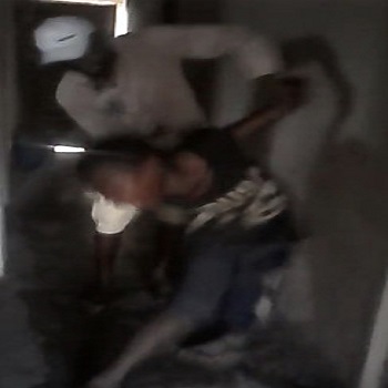 black Boy caught stealing inside a house is punishment with a stick