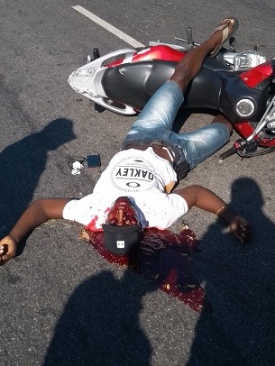 Thief Shot in the Face Bleeds out and Agonizes before Death Beside Work tool