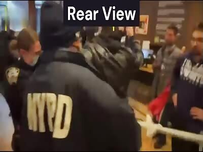 Angry Cop Wipes Her Feet On US Flag!