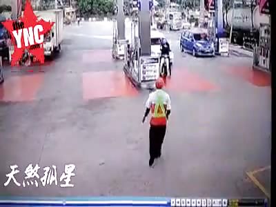 The motorcycle driver was hit by a car at the petrol station