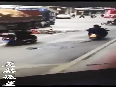 construction falls on a couple of scooter riders killing one of them