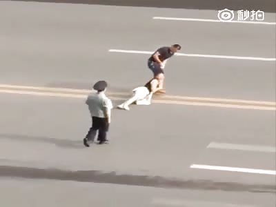 Woman dragged by hair.