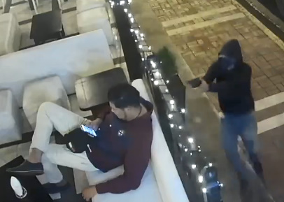 Man Enjoying theYNC.com on Phone Gunned Down By Hitman