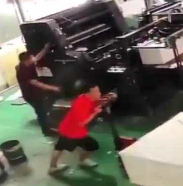 Printing Machine Worker Makes Grim Mistake