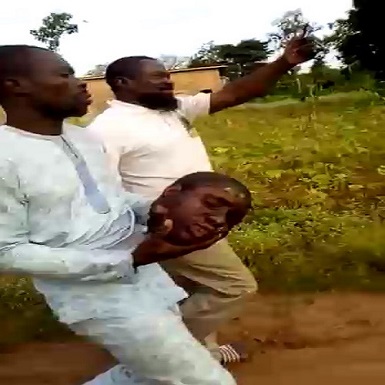 Ritualist Calmly Walks With Human Head